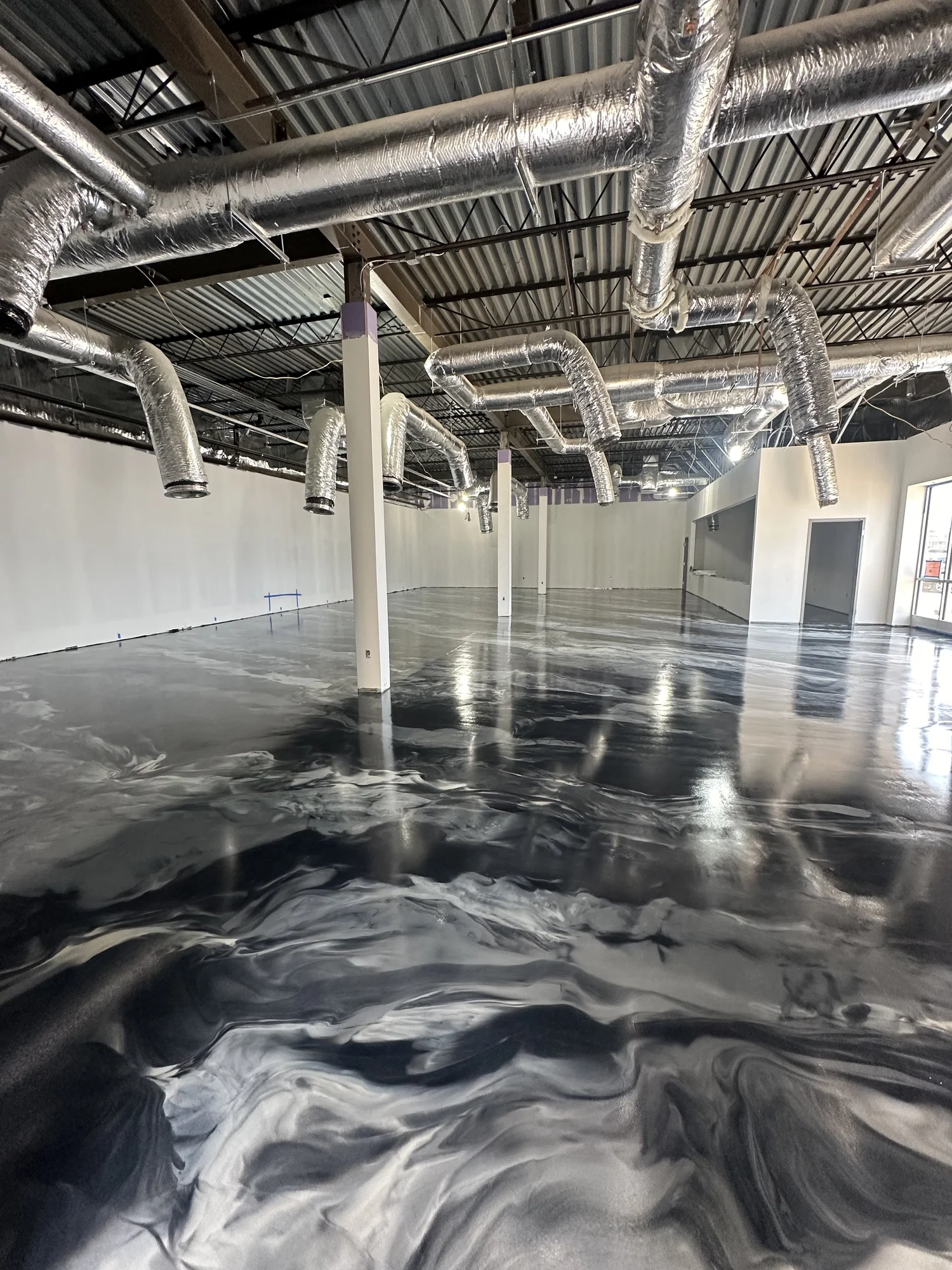 Commercial epoxy floor coating in a New Jersey warehouse