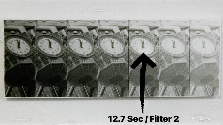 Darkroom test strip with the clock highlights marked to evaluate exposure at 12.7 seconds using filter 2 with the Perfect Test Strip Printer Darkroom test strip with the clock highlights marked to evaluate exposure at 12.7 seconds using filter 2 with the Perfect Test Strip Printer
