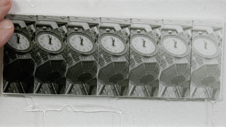 First look at a developed darkroom test strip made with the Perfect Test Strip Printer, placed on a viewing board to evaluate the clock highlights First look at a developed darkroom test strip made with the Perfect Test Strip Printer, placed on a viewing board to evaluate the clock highlights