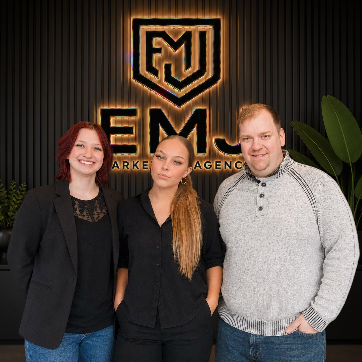 EMJ Marketing Group Team planning local growth strategy on whiteboard