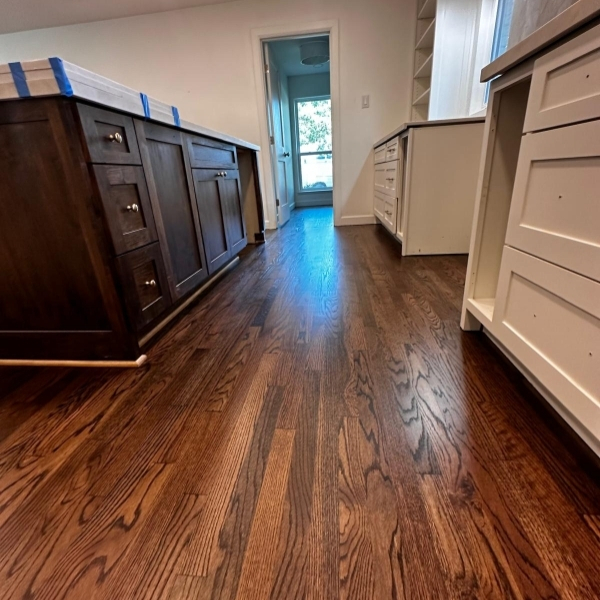 Stain color matching during hardwood floor refinishing Dallas, TX for seamless style.