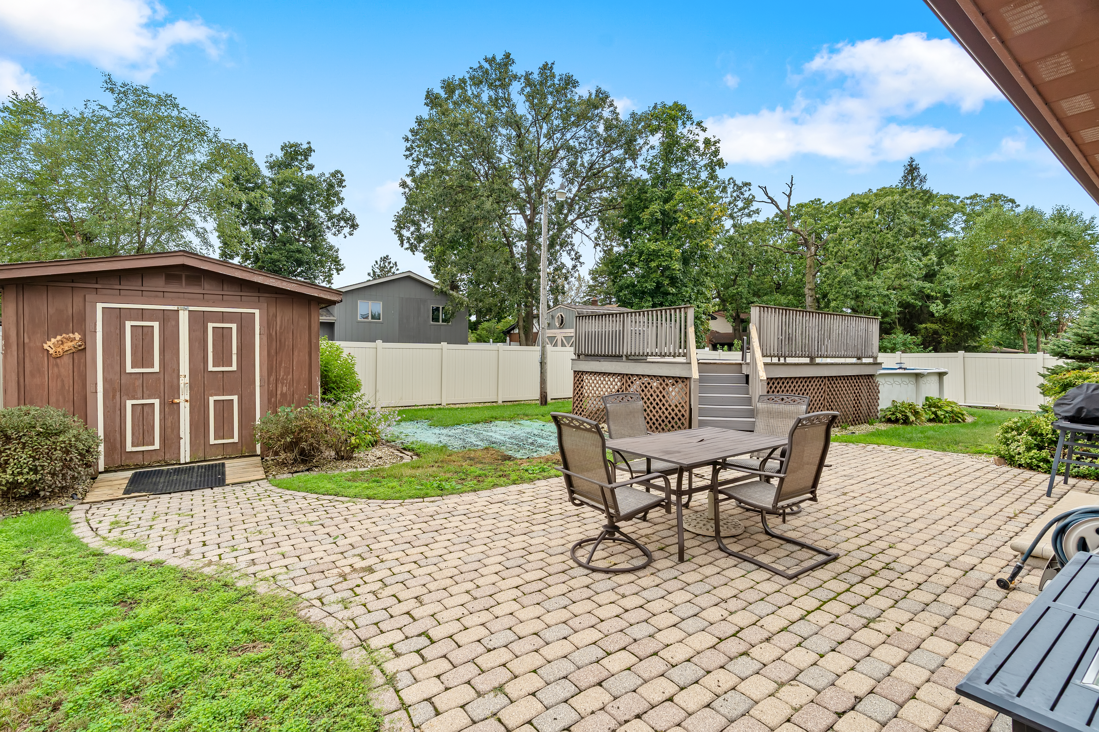 506 Heather Ln fenced backyard with above ground pool and deck