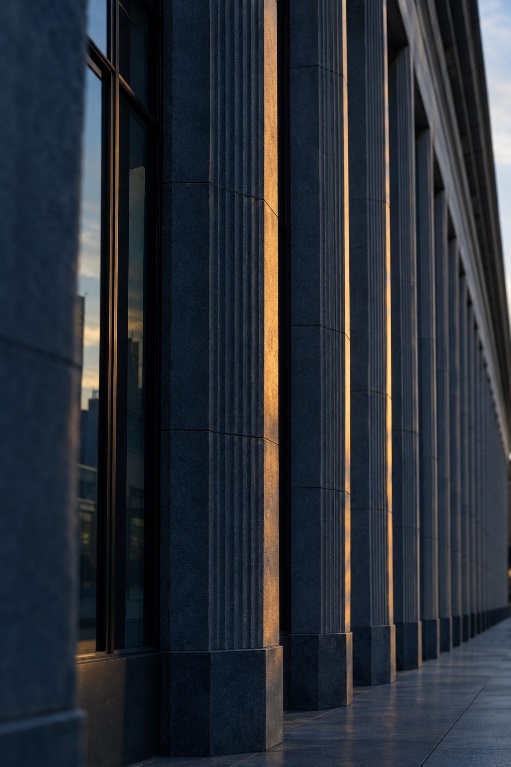 Colonnade of a federal office building at dusk