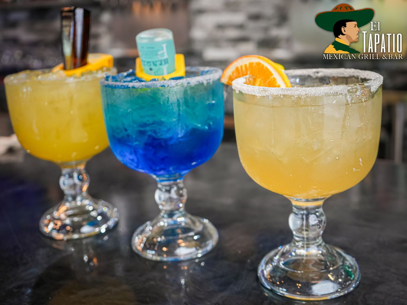 El Tapatio red sangria margarita with orange wedge