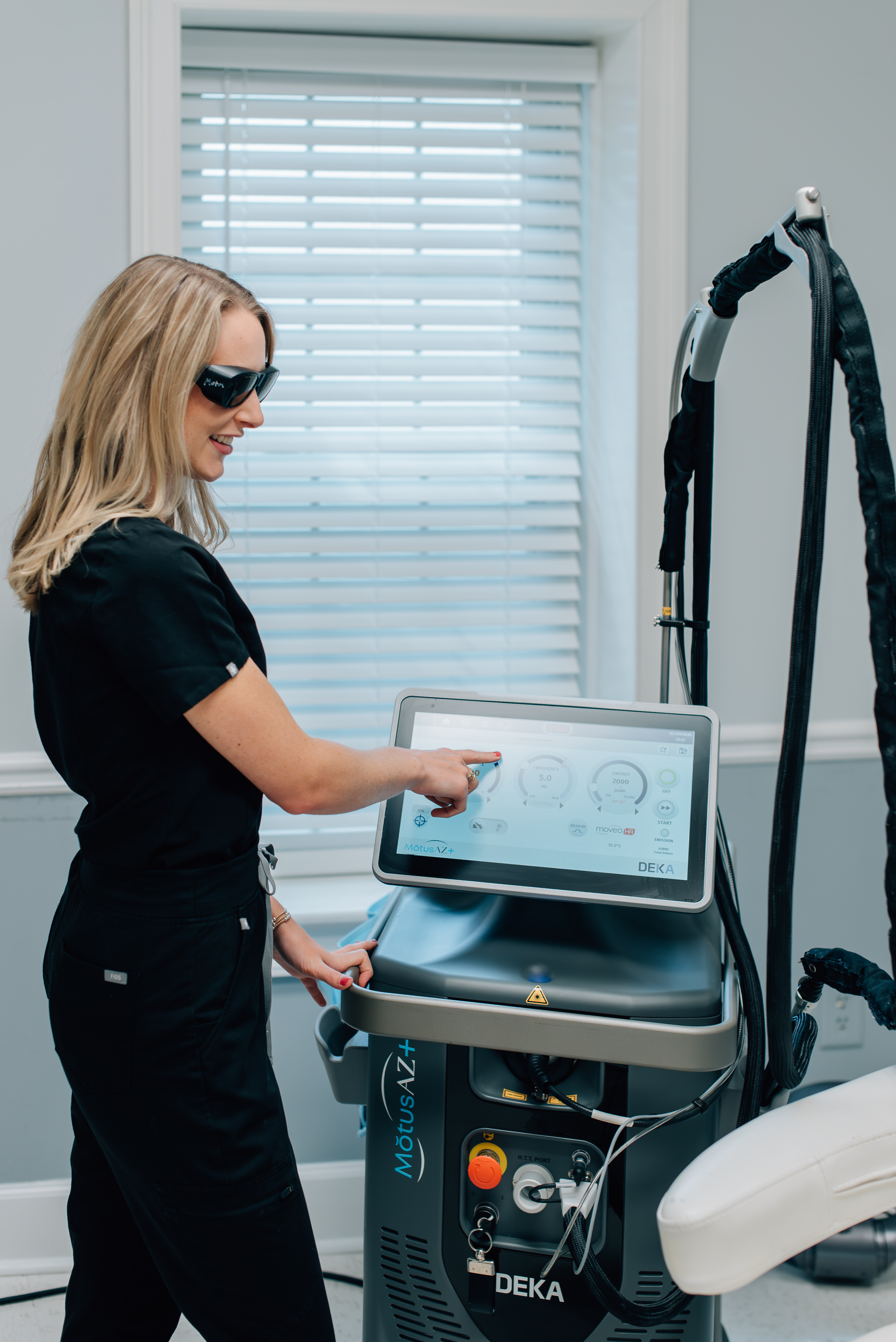 MOTUS AZ+ laser device and clinician at Slater Aesthetics