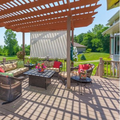 Backyard patio deck with an overhead pergola