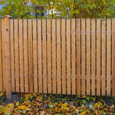 Vertical slat wooden privacy fence