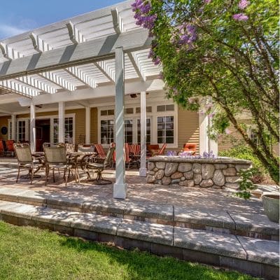 Elegant white pergola with outdoor dining area