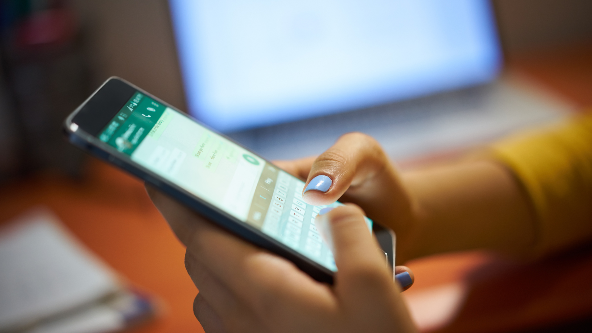 Person sharing a digital name card through WhatsApp after a networking event Person sharing a digital name card through WhatsApp after a networking event