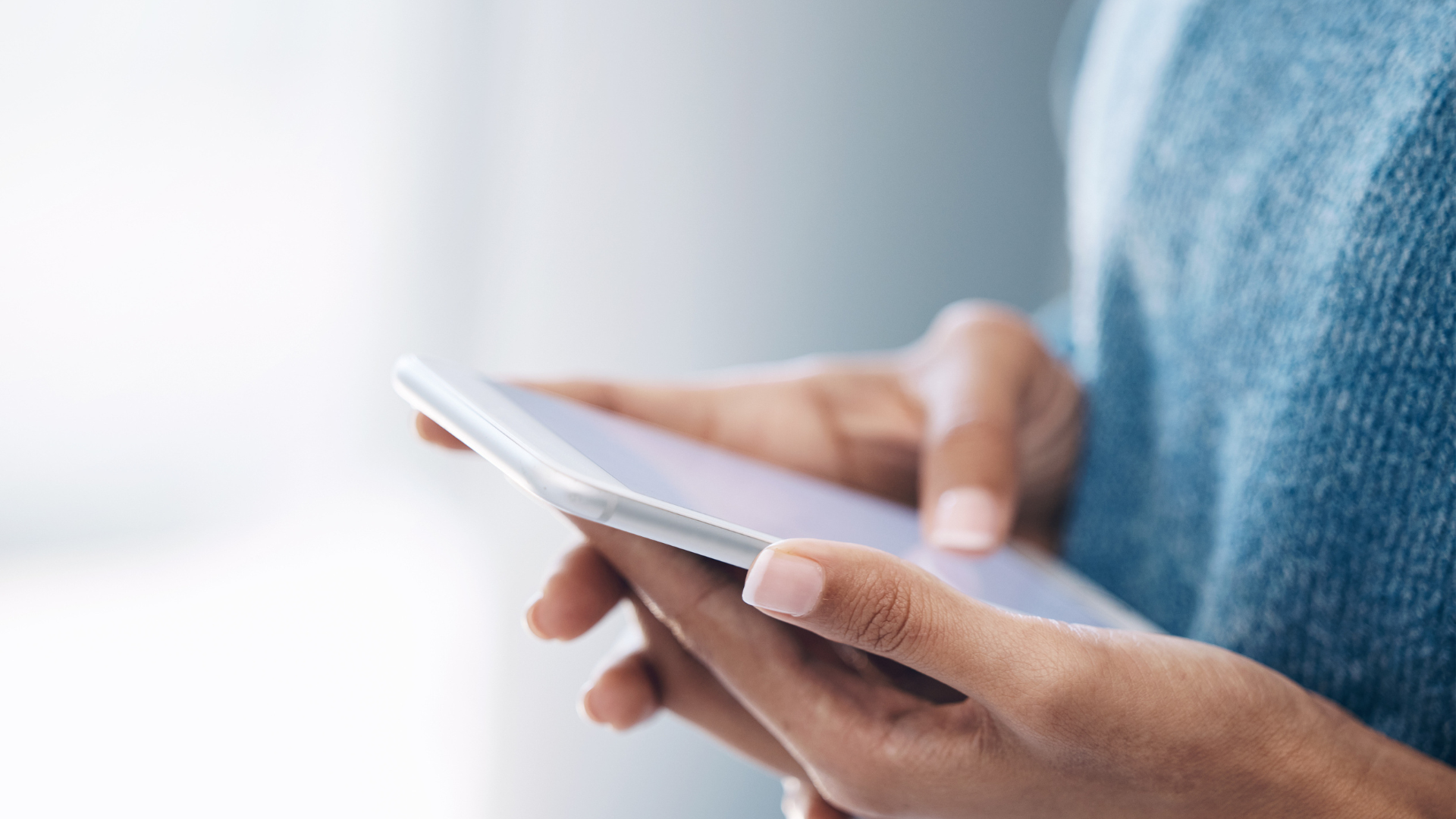 Person using a phone to share a digital name card Person using a phone to share a digital name card