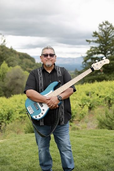 John Calderon with his bass guitar