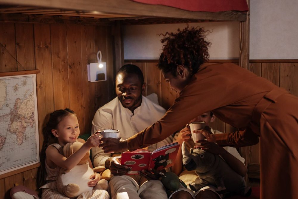 Parent reading a bedtime story to a child as part of the evening wind-down routine