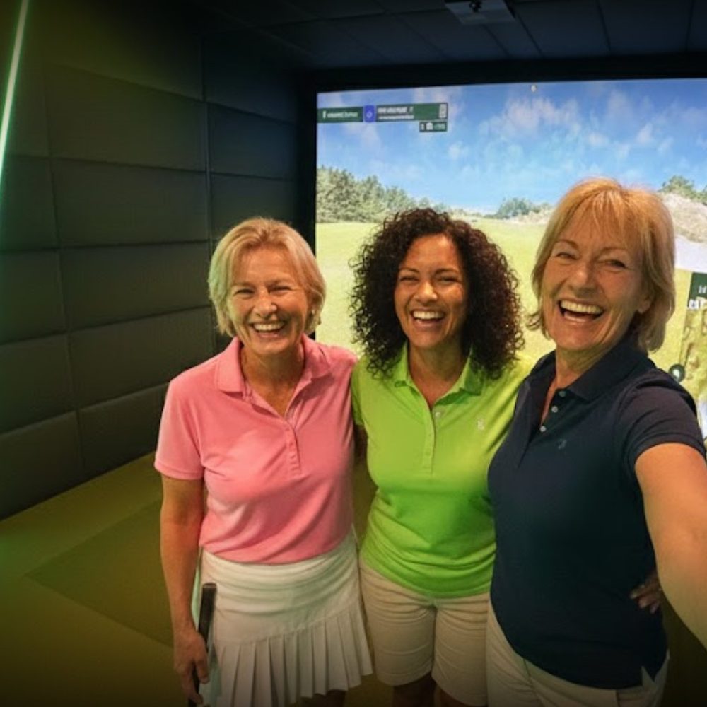 Group of friends enjoying Eagle Bay Golf Sims