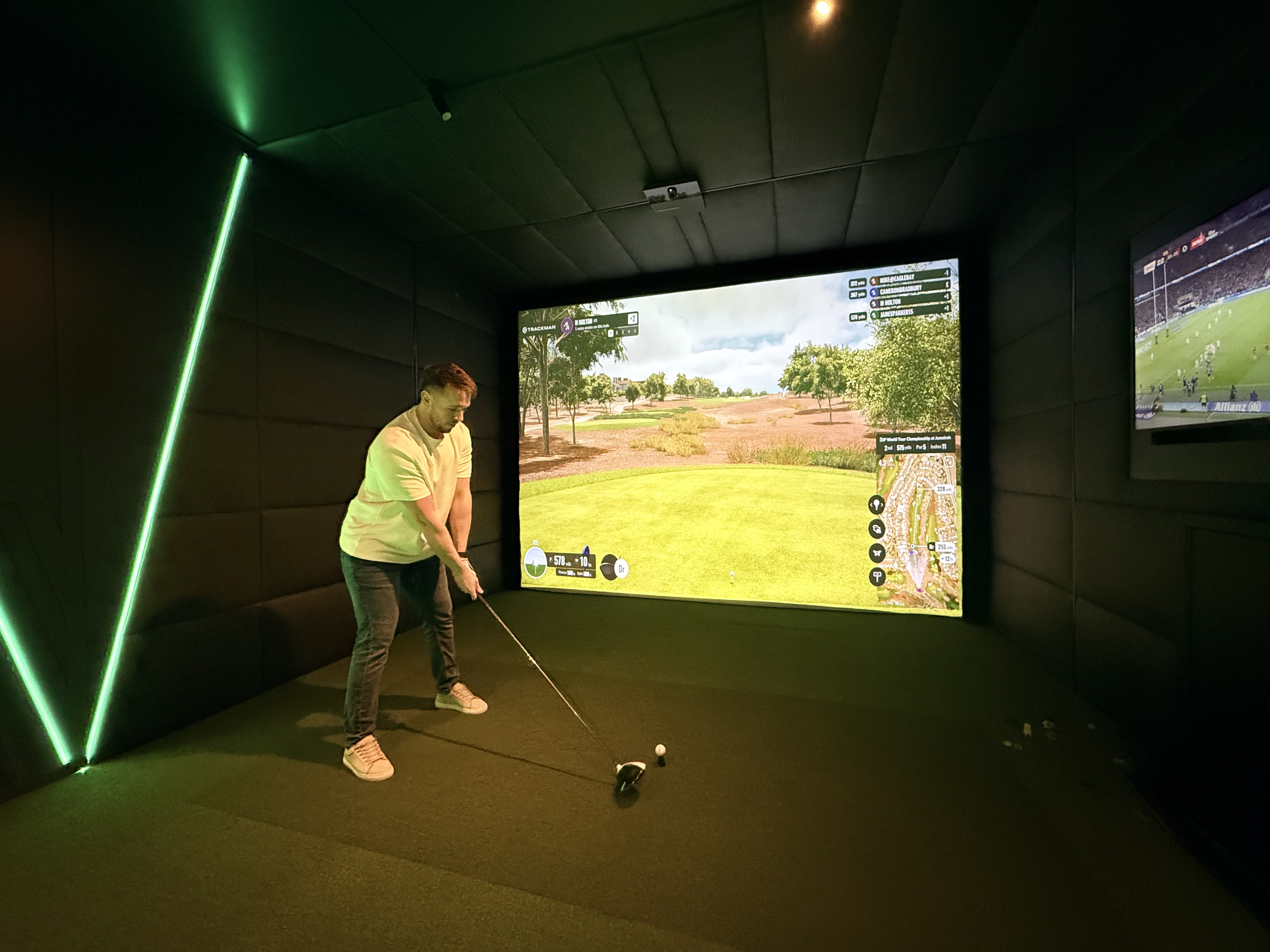 Player putting in Eagle Bay simulator bay