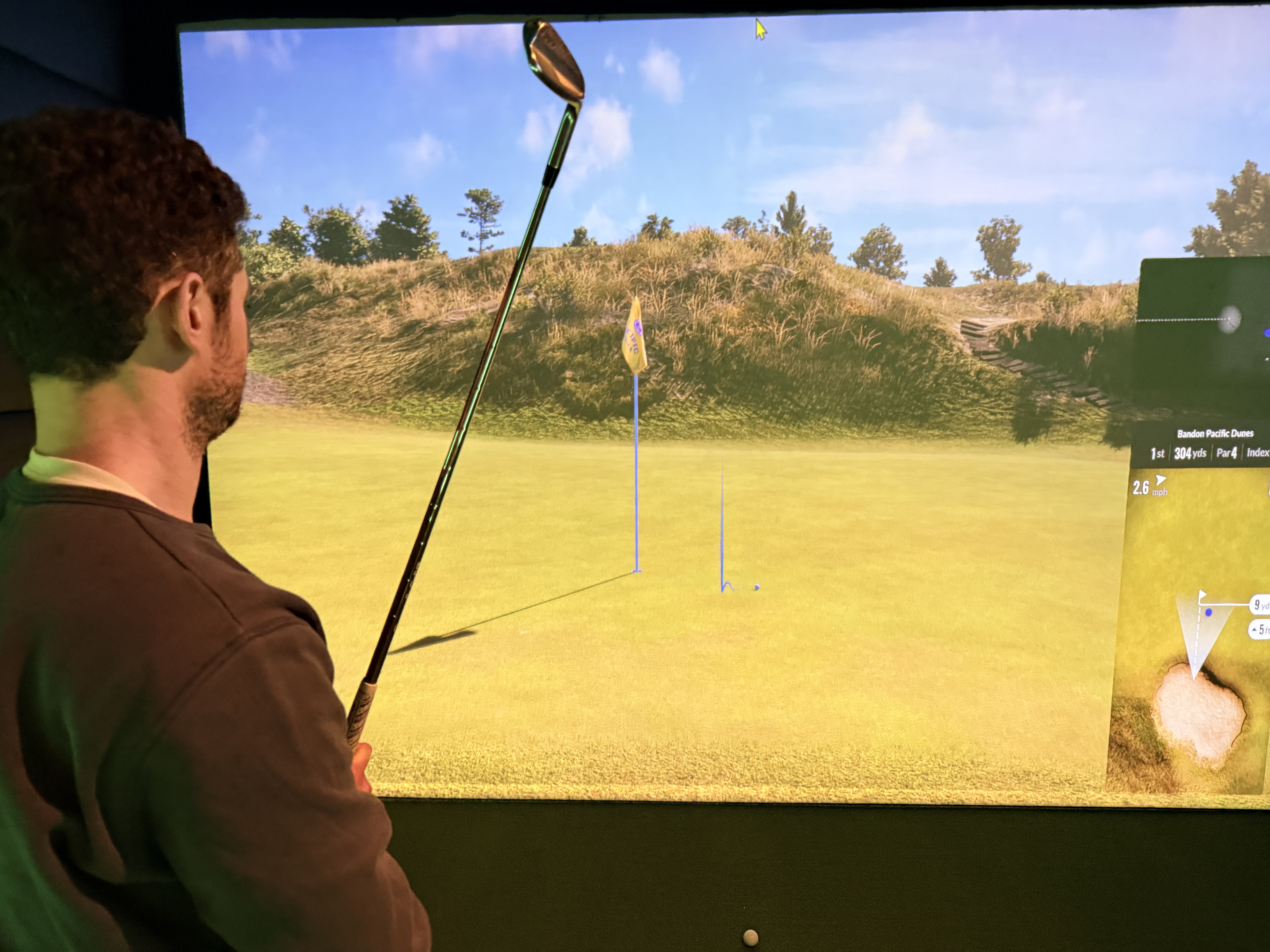 Player chipping in Eagle Bay Golf Sims bay
