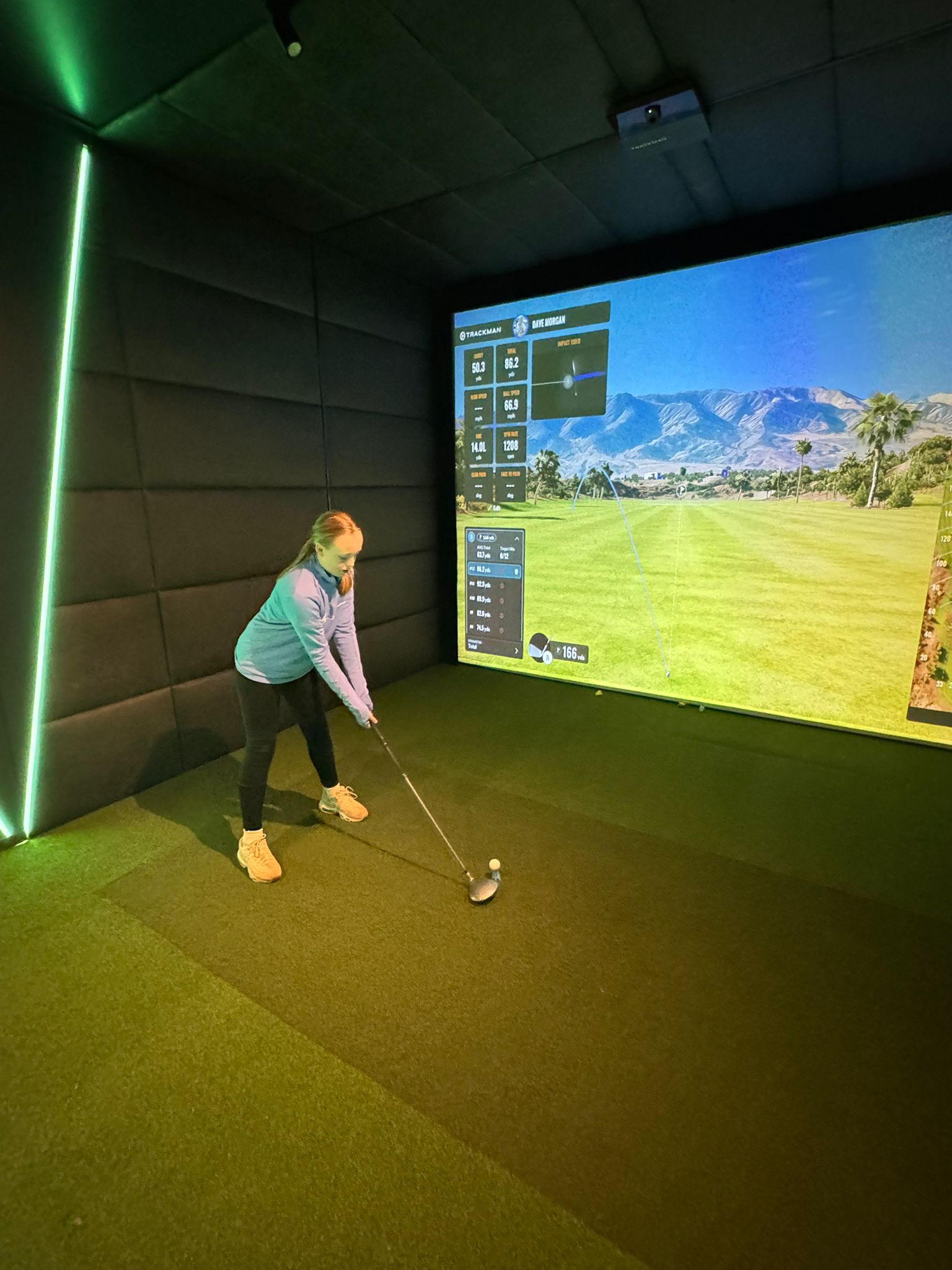 Female golfer in Eagle Bay Golf Sims bay