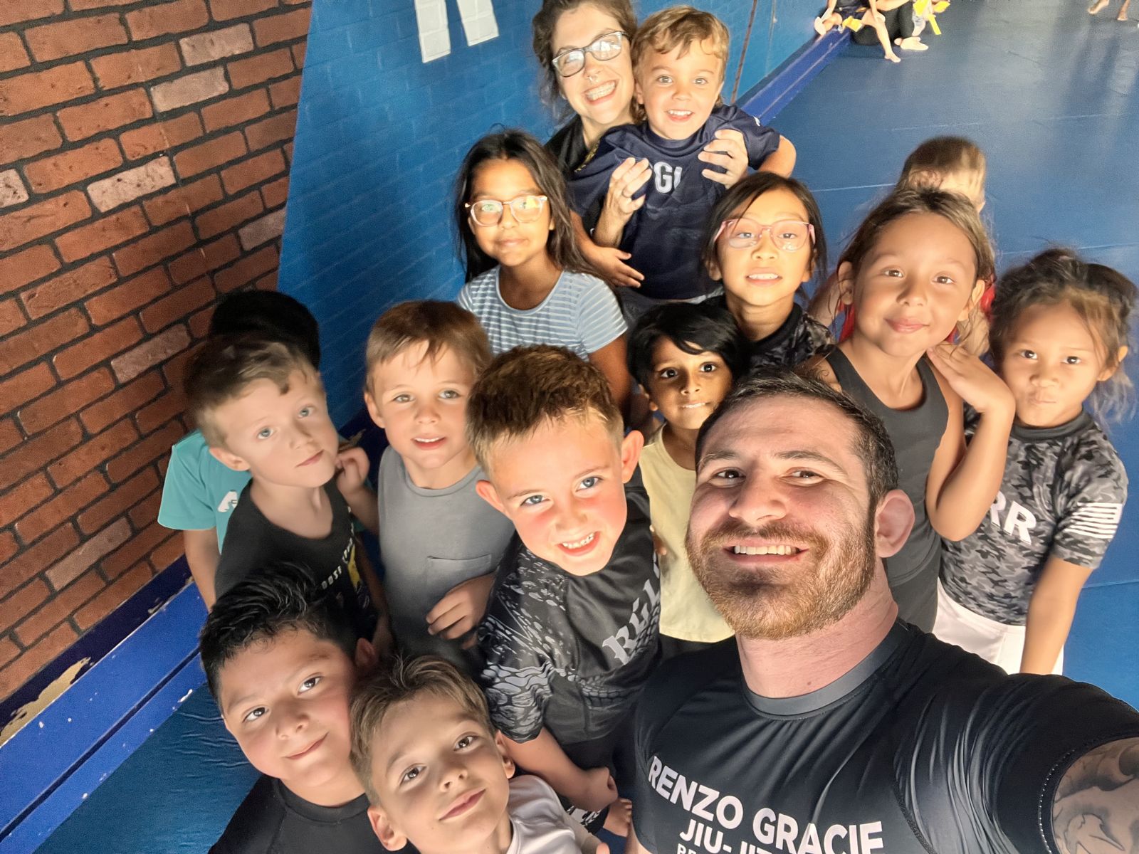Kids smiling with their coach