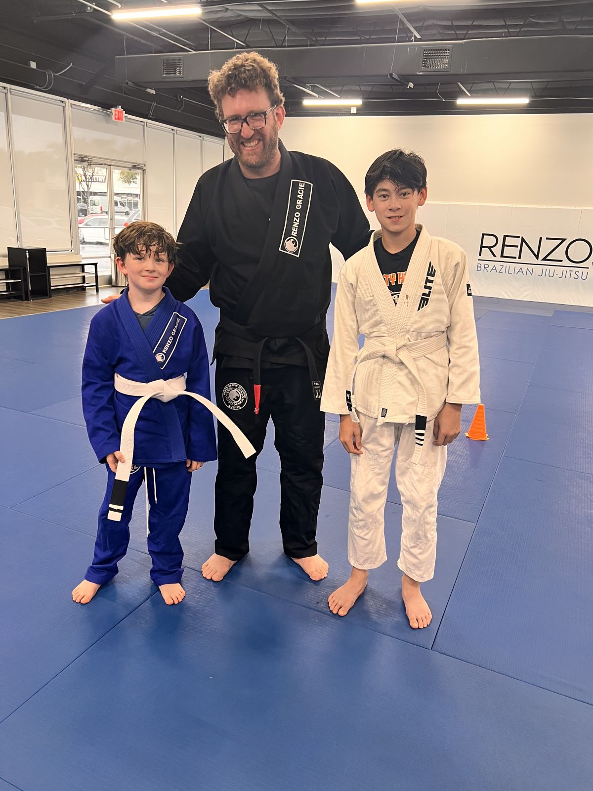 Coach with two young students