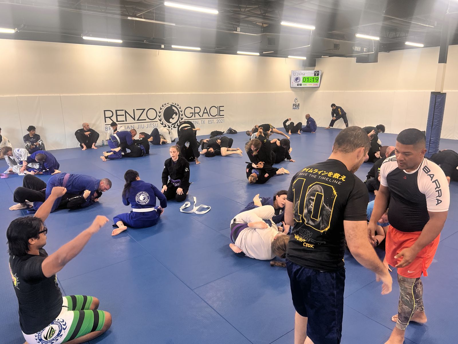 Adults training on the mats