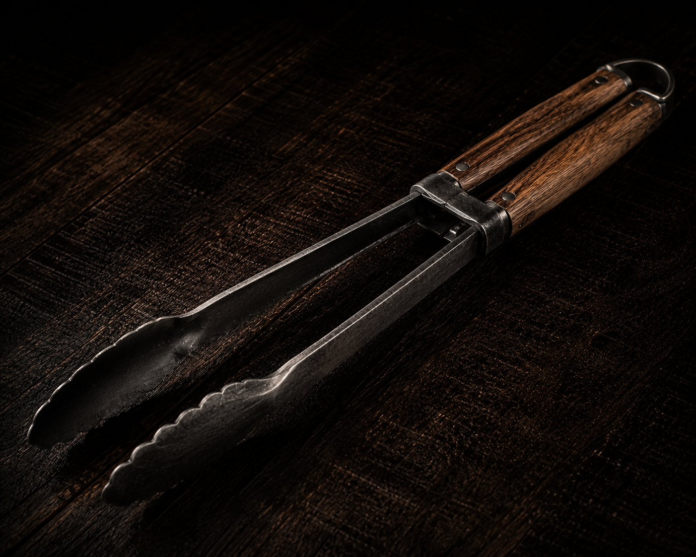 Pinza pesada de hierro forjado para mover la brasa