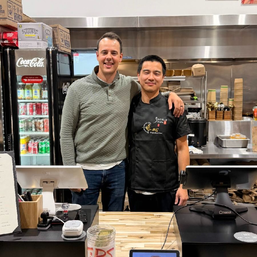 Ryan Hreczkosiej of Hybrid Storytellers with John, owner of the Jackie Inn, in the restaurant's kitchen