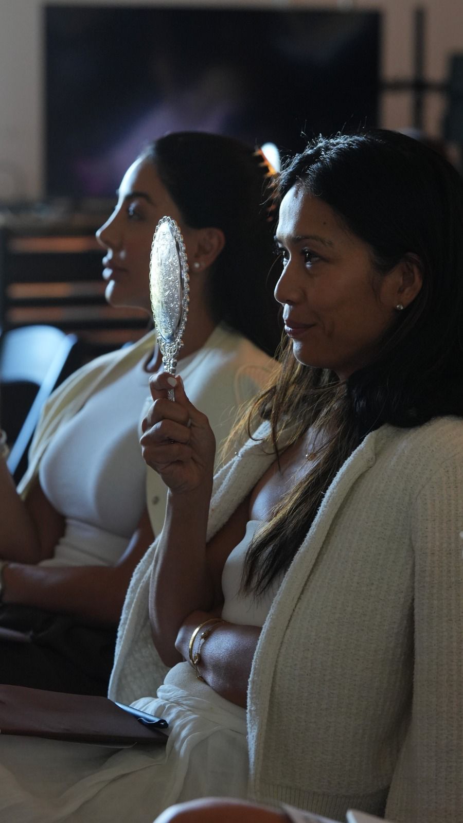 Two women practicing mirror work exercise at Liz Kennedy event