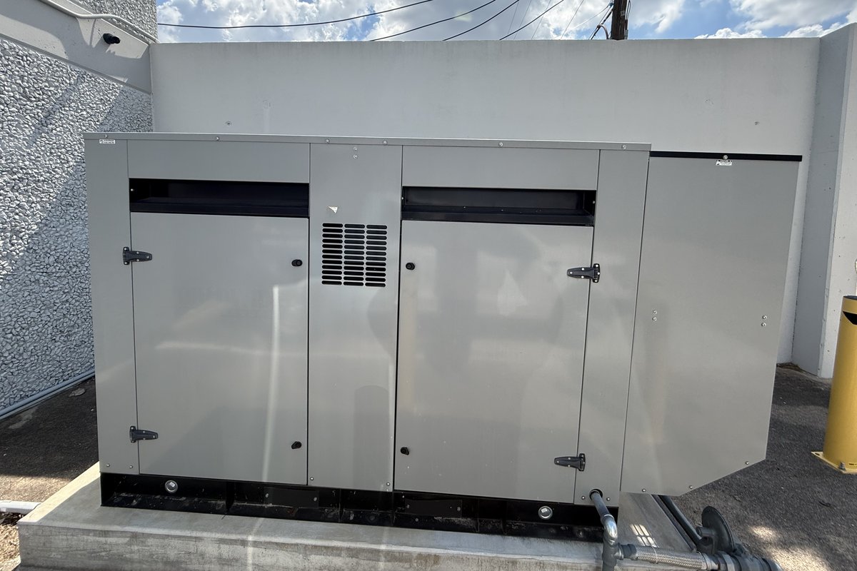 Gillette commercial standby generator installed on a concrete pad at a Houston warehouse