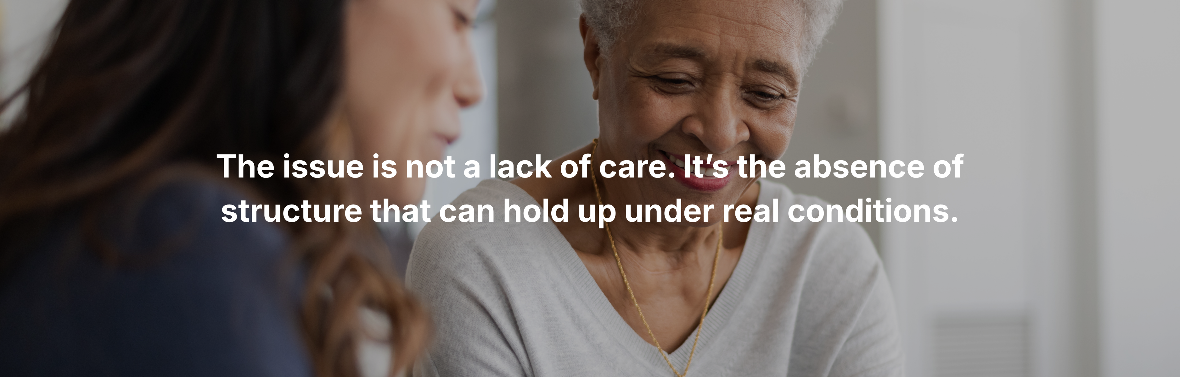 Smiling elderly couple waving with text about building or improving a personal care home, senior living and elder care services concept Smiling elderly couple waving with text about building or improving a personal care home, senior living and elder care services concept