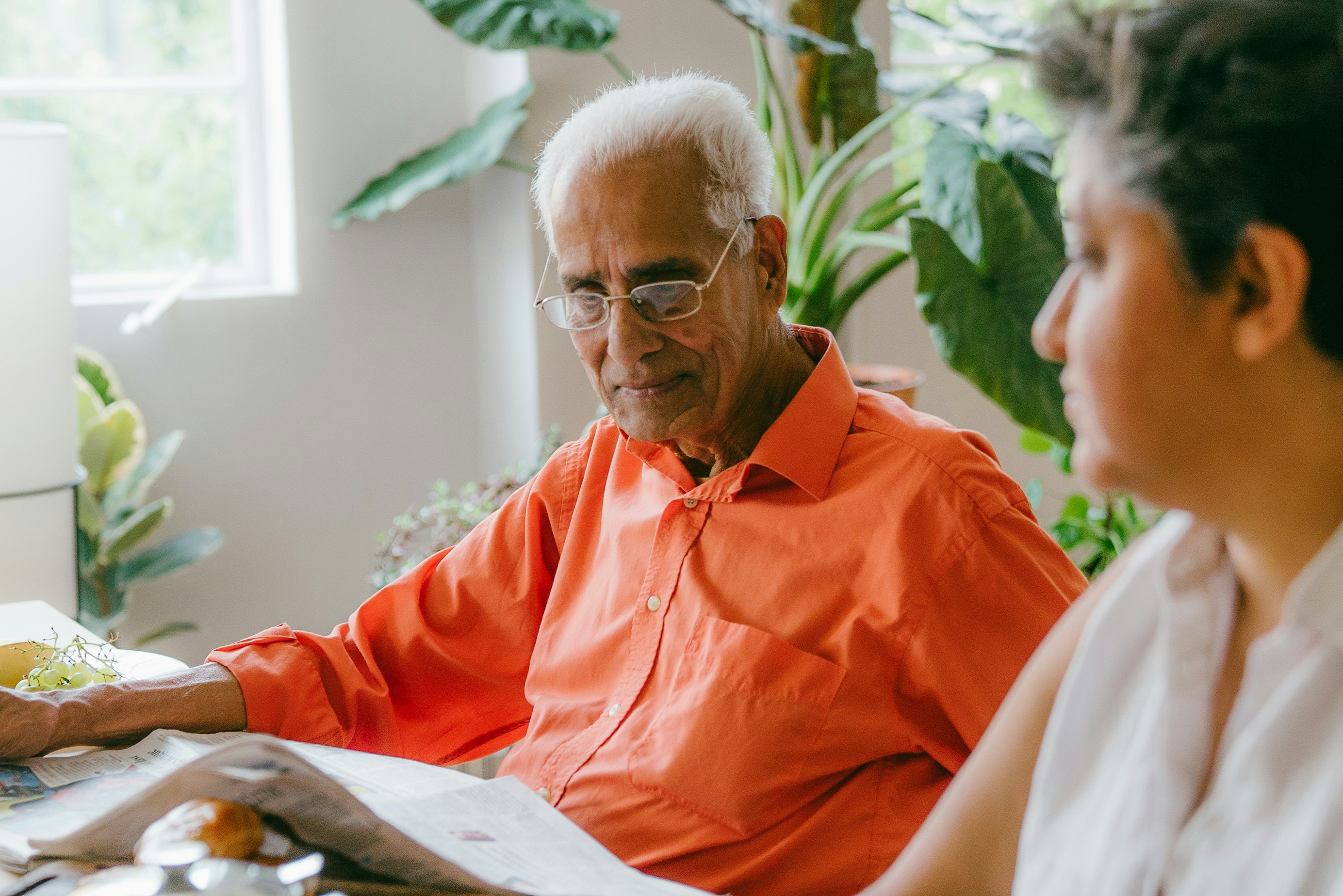 Elderly man looking at documents Elderly man looking at documents