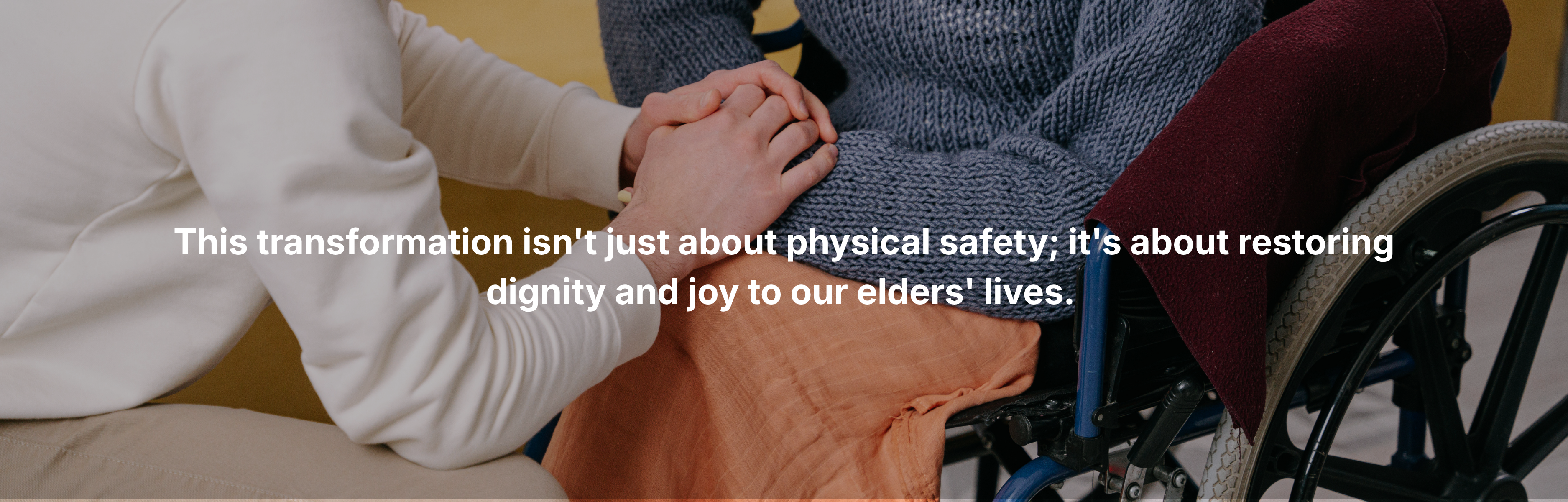 Caregiver holding hands with an elderly person in a wheelchair, representing compassion, dignity, and emotional support in senior care