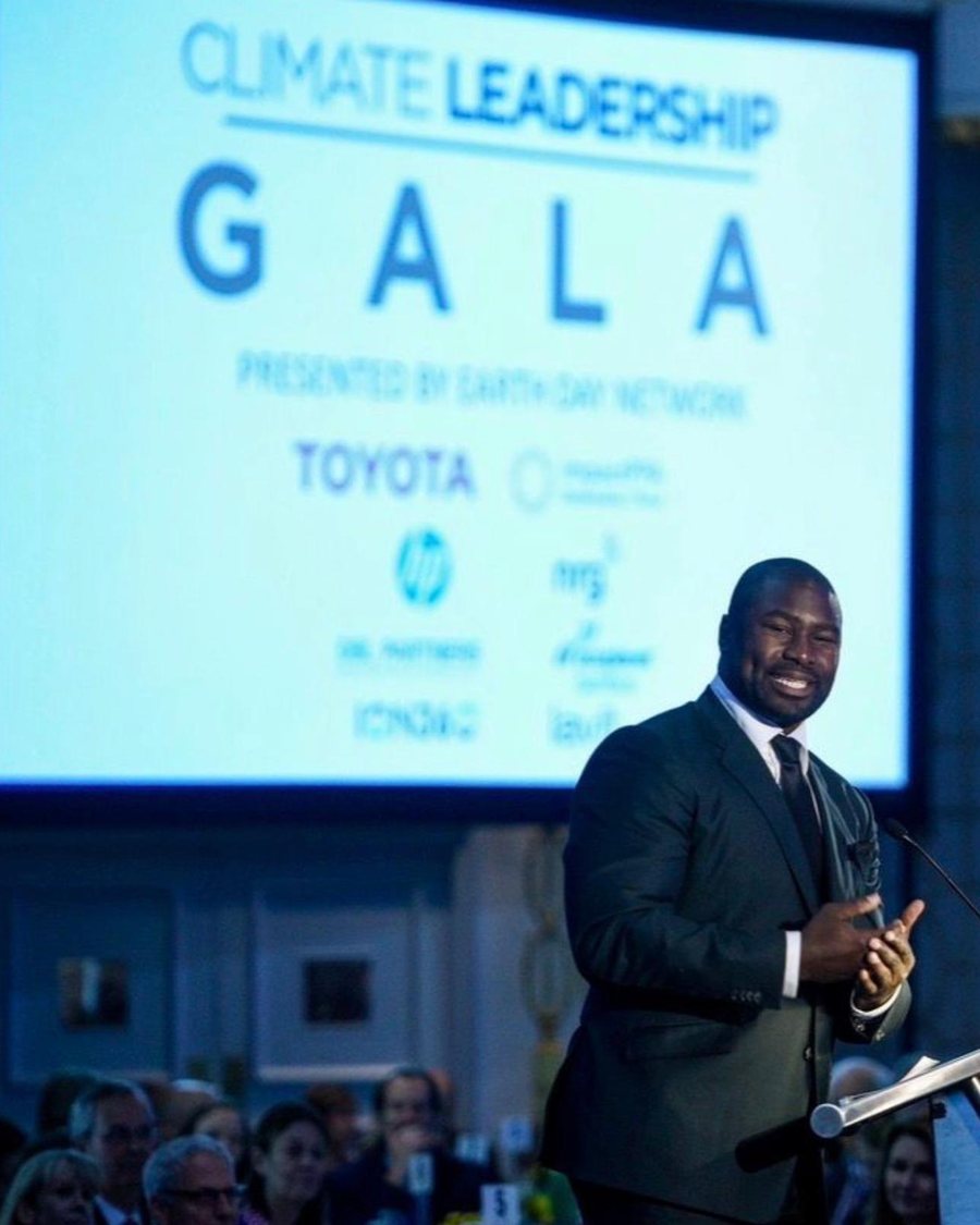 Ovie Mughelli speaking at a climate leadership gala
