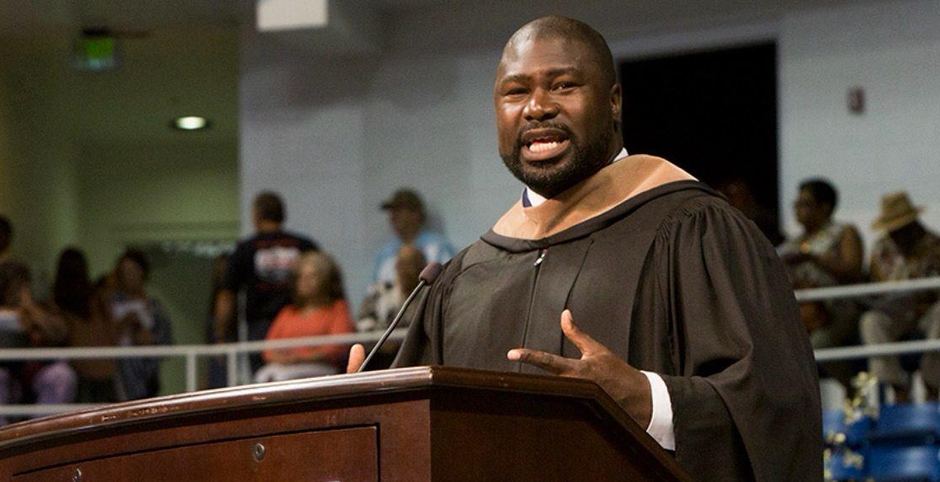 Ovie Mughelli delivering a commencement address