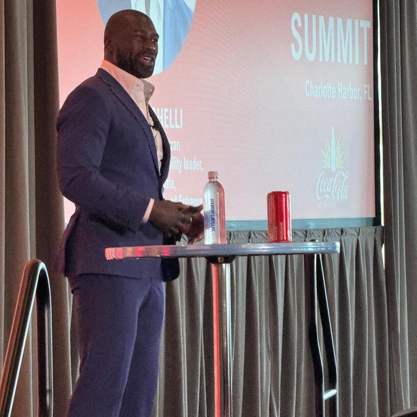 Ovie Mughelli on stage at a business summit
