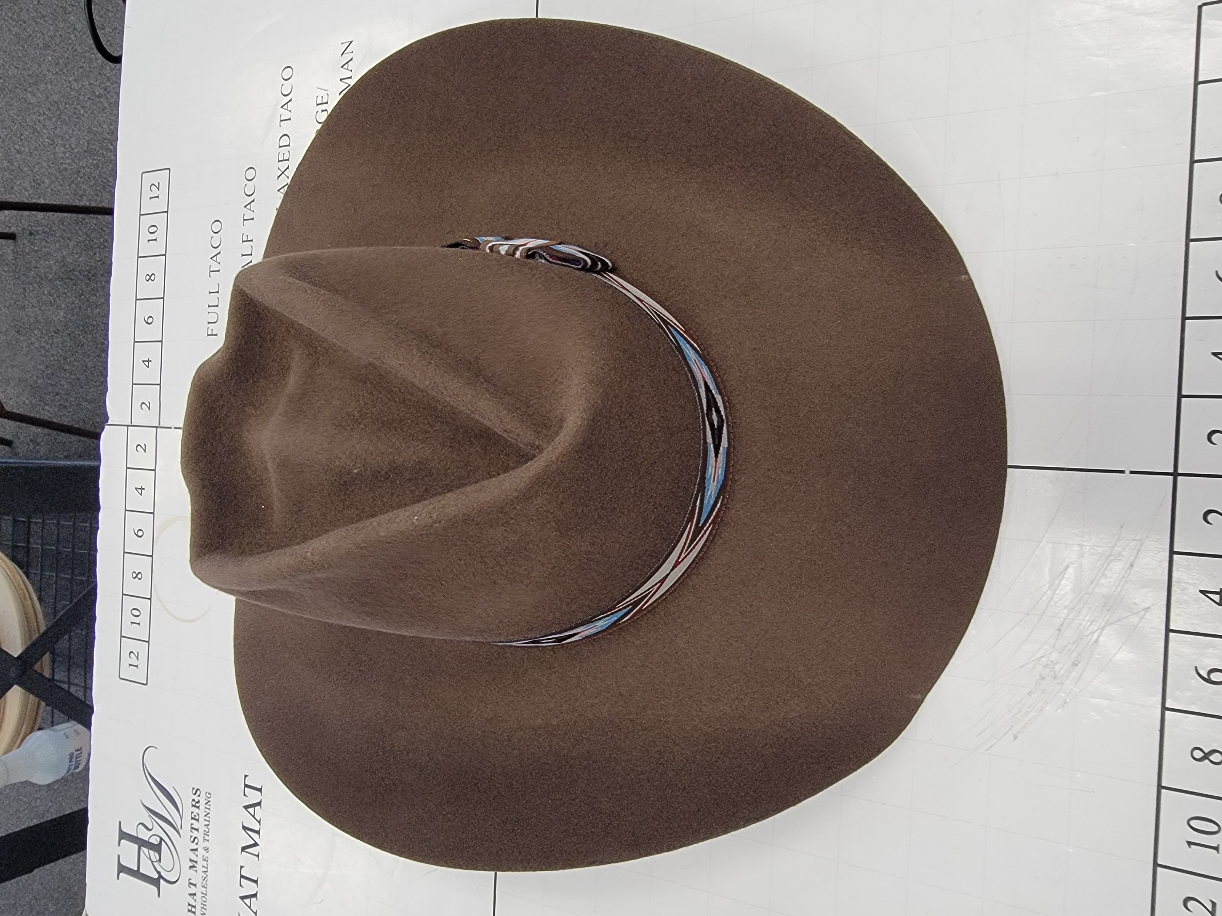 Brown felt cattleman hat with a woven hatband