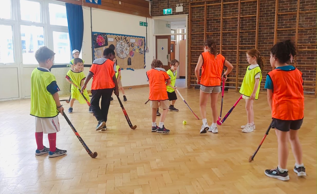 Madz running a multi-sports session with children in North London