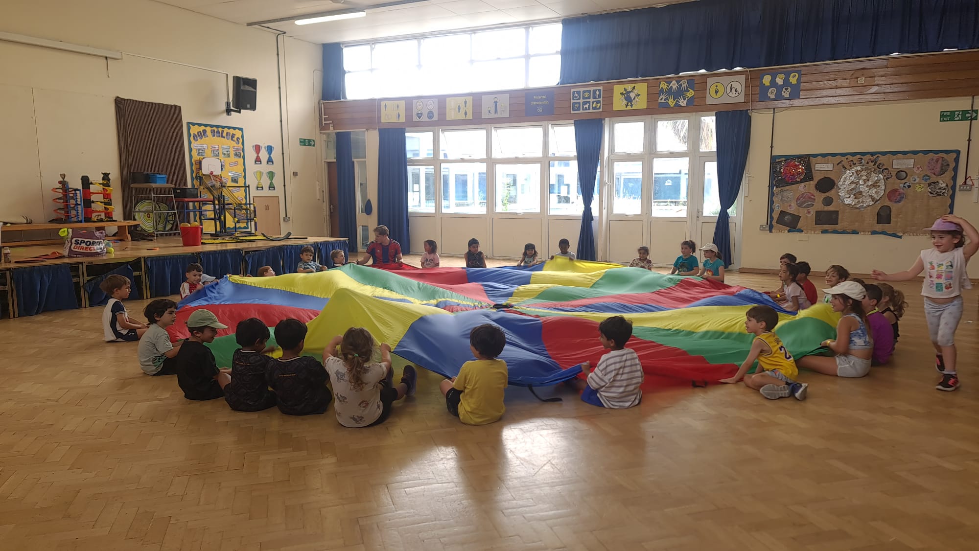 Children playing group games at a Mad4Sports holiday camp in North Finchley