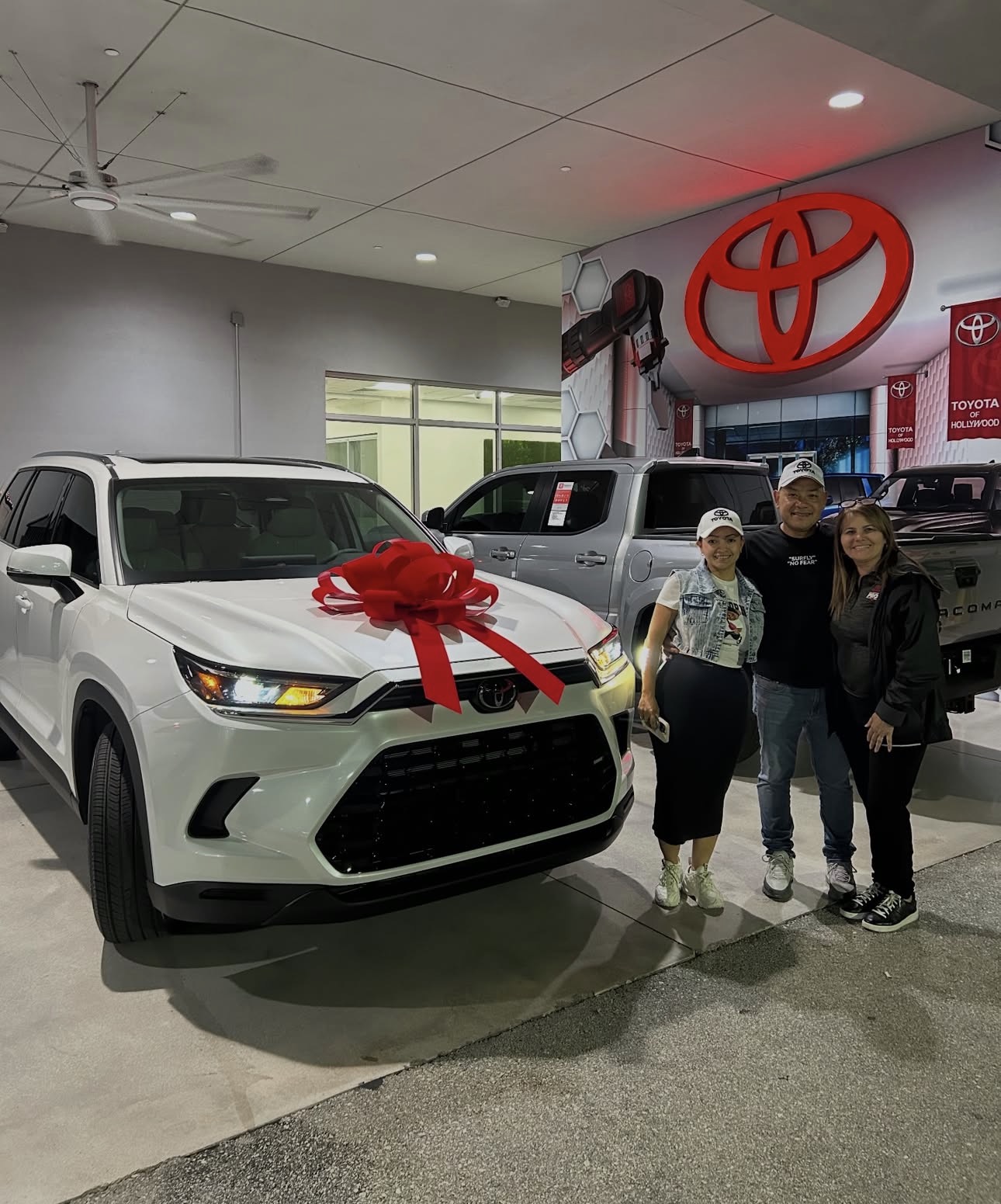 Sandra with happy client and their new Toyota