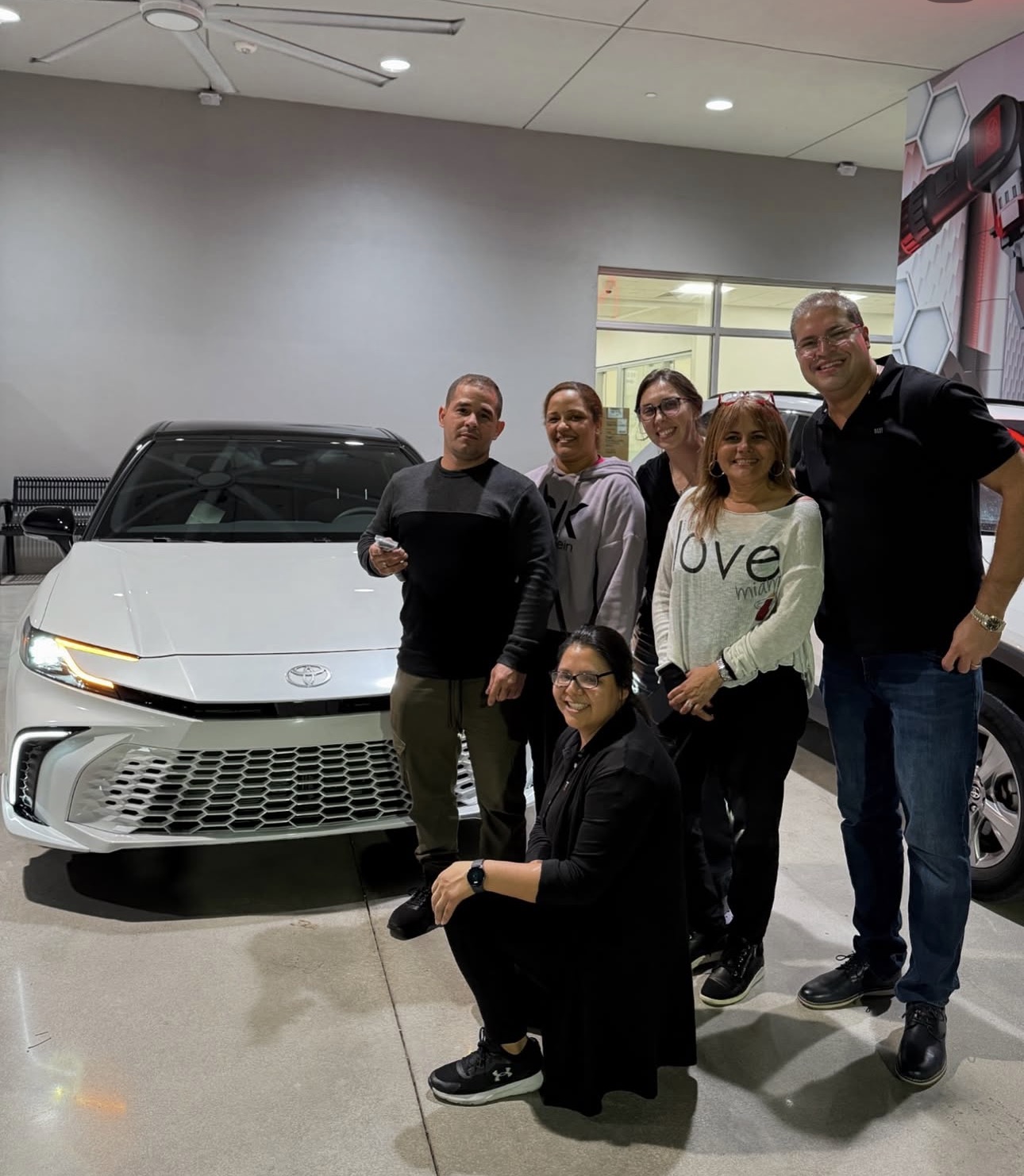 Sandra with happy client and their new Toyota