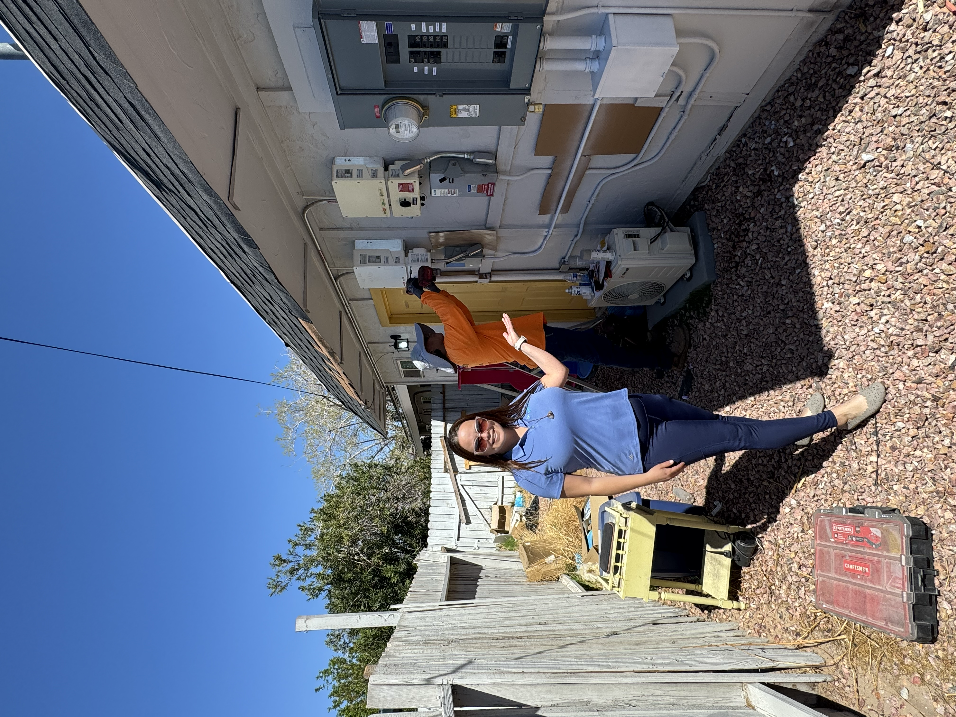 Amber Rose Castellon onsite with an RG Electric electrician during the Borrego solar installation in Las Vegas, Nevada