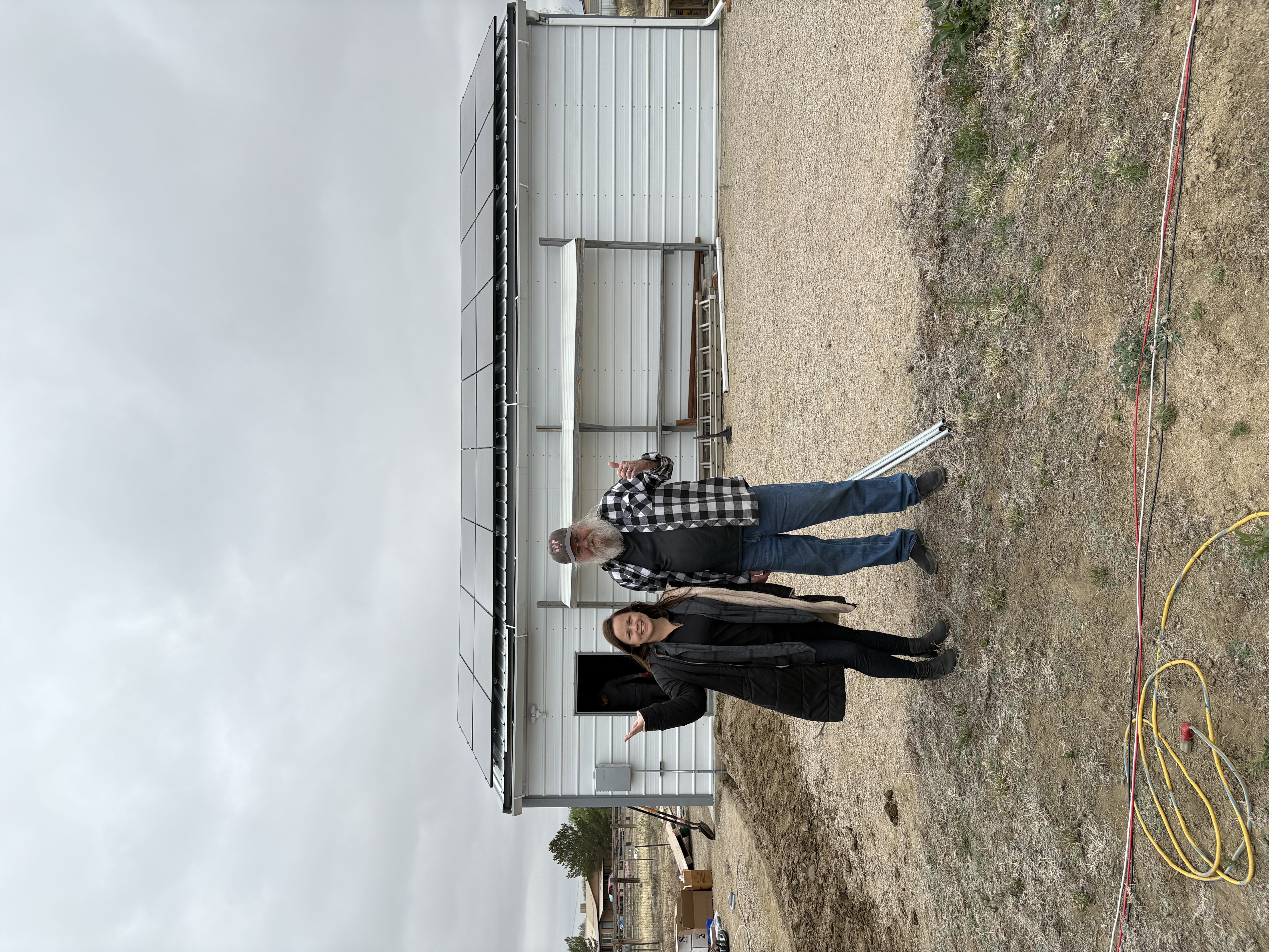 Amber Rose Castellon with a homeowner during a solar installation