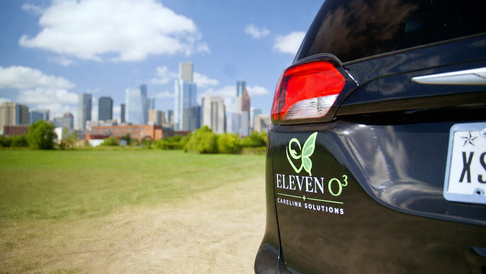 ElevenO3 transportation vehicle with the Houston skyline