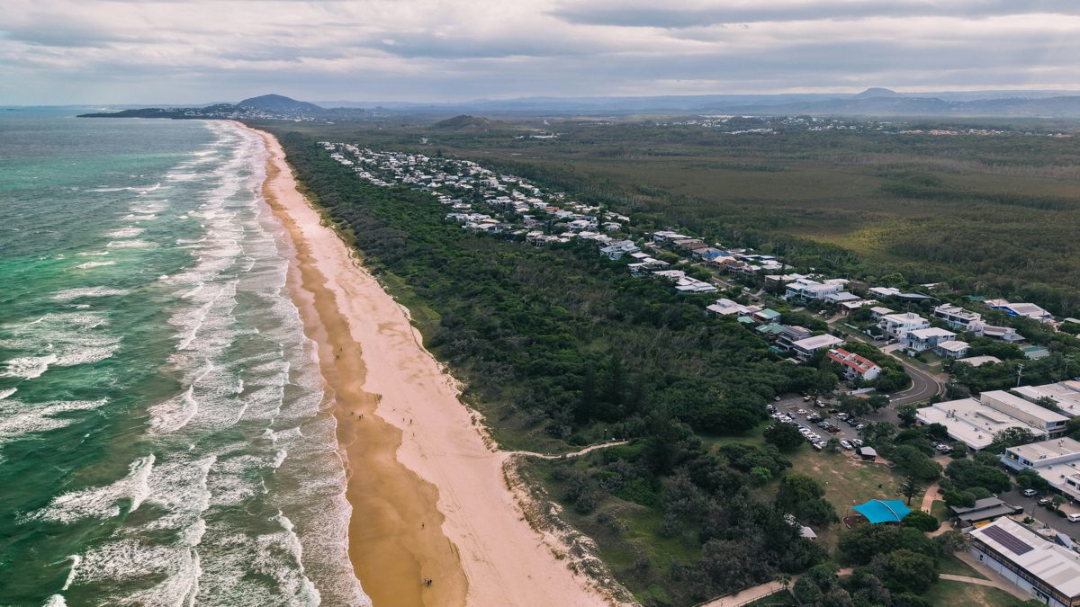 Aerial view of coastal homes along the beach in South East Queensland