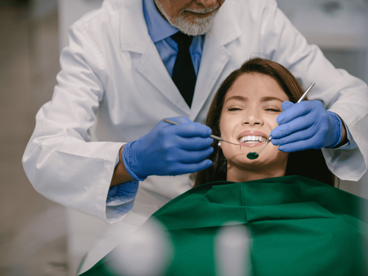 Dental hygienist performing professional teeth cleaning