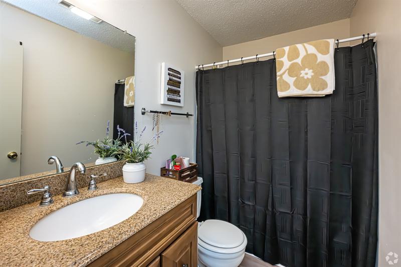 Two-bedroom bathroom with a granite vanity