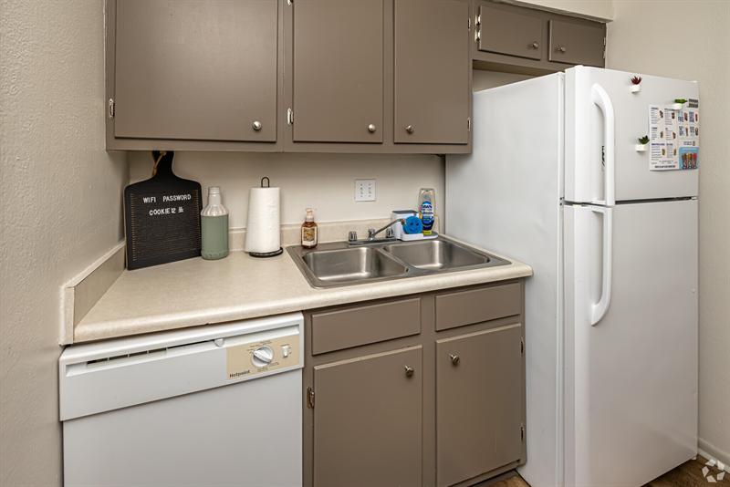 One-bedroom kitchen with sink, dishwasher and refrigerator