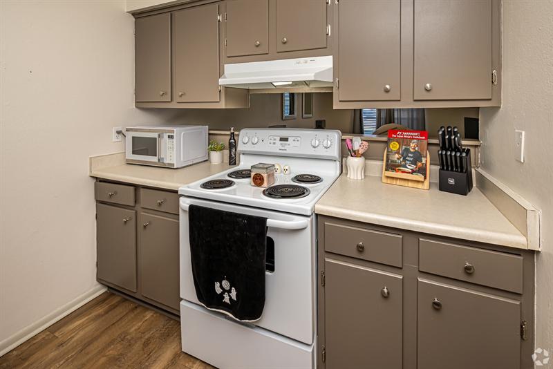 One-bedroom kitchen with electric range and microwave