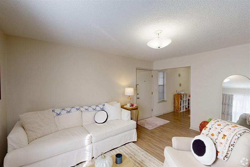 Two-bedroom living room looking toward the kitchen