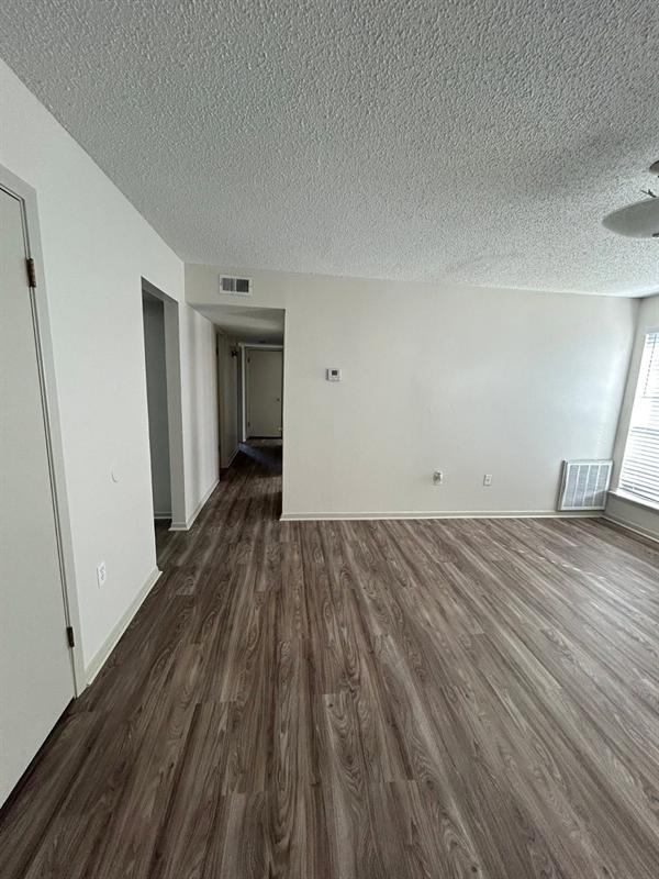 Renovated living room with new wood-look plank flooring