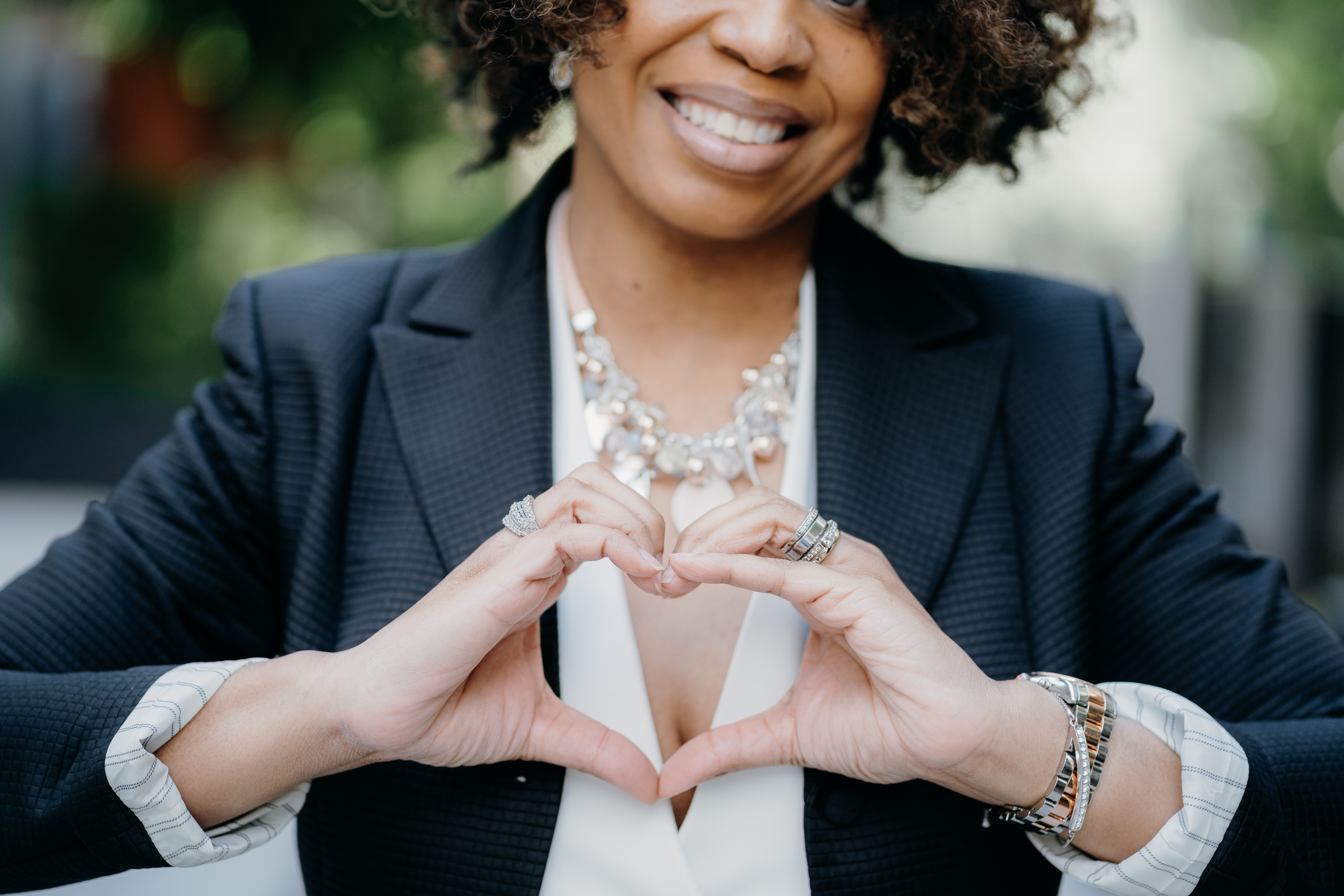 Momentology portrait with heart hands