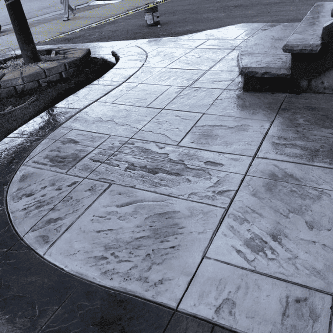 Stamped concrete walkway with stone pattern